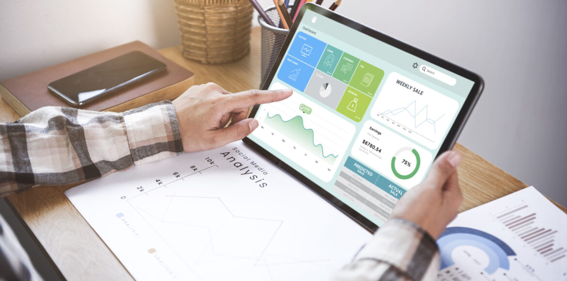 Businesswoman using a tablet to analysis graph company finance s Businesswoman using a tablet to analysis graph company finance strategy statistics success concept and planning for future in office room.